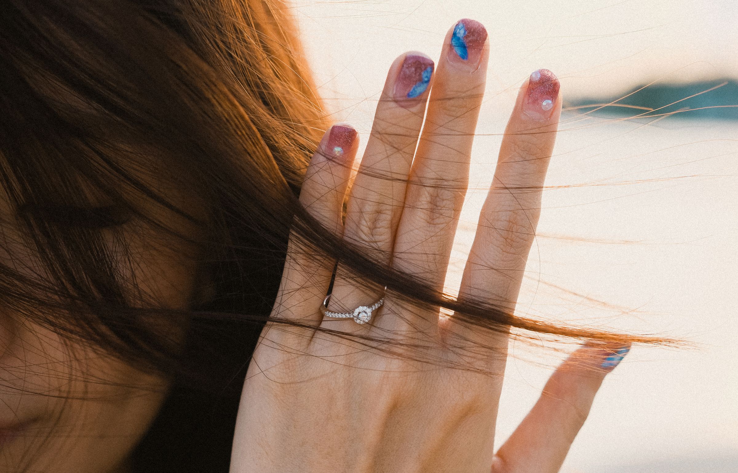 Soft pink nail art with blue accents