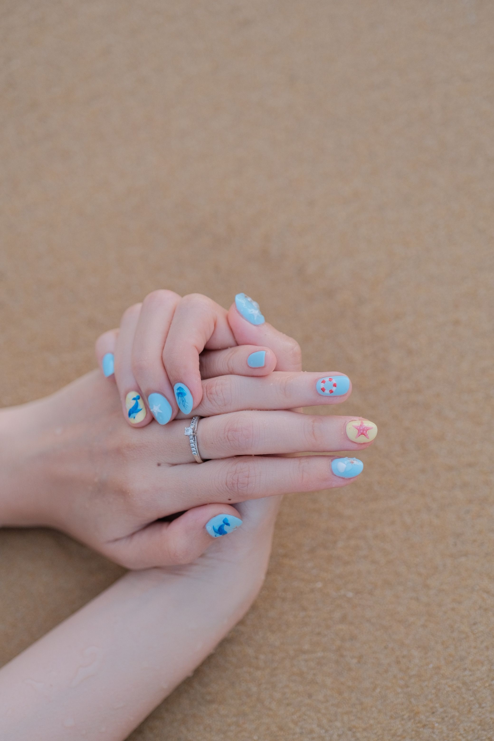 Blue beach-themed nail art